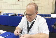 Lang examines coins at the NGC booth