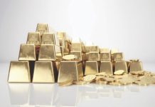 Gold bar and gold coin on white background.